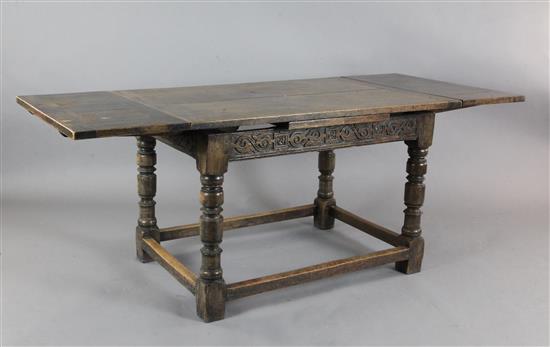 A 17th century style oak draw leaf table, W.4ft D.2ft 8in. H.2ft 6in.